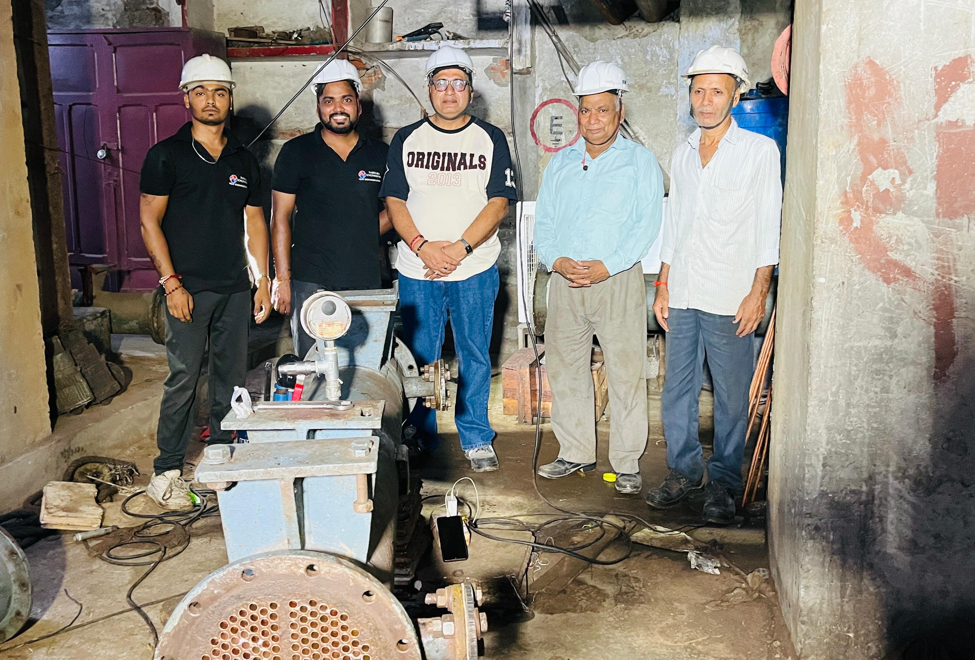 Narmada Engineering team reviewing technical drawings